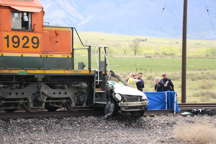 Two people were killed after a car and train collided at Highway 85, south of Ron King Trail on May 15.Photo by Alex DeWind